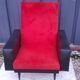 Black leatherette armchair and red fur