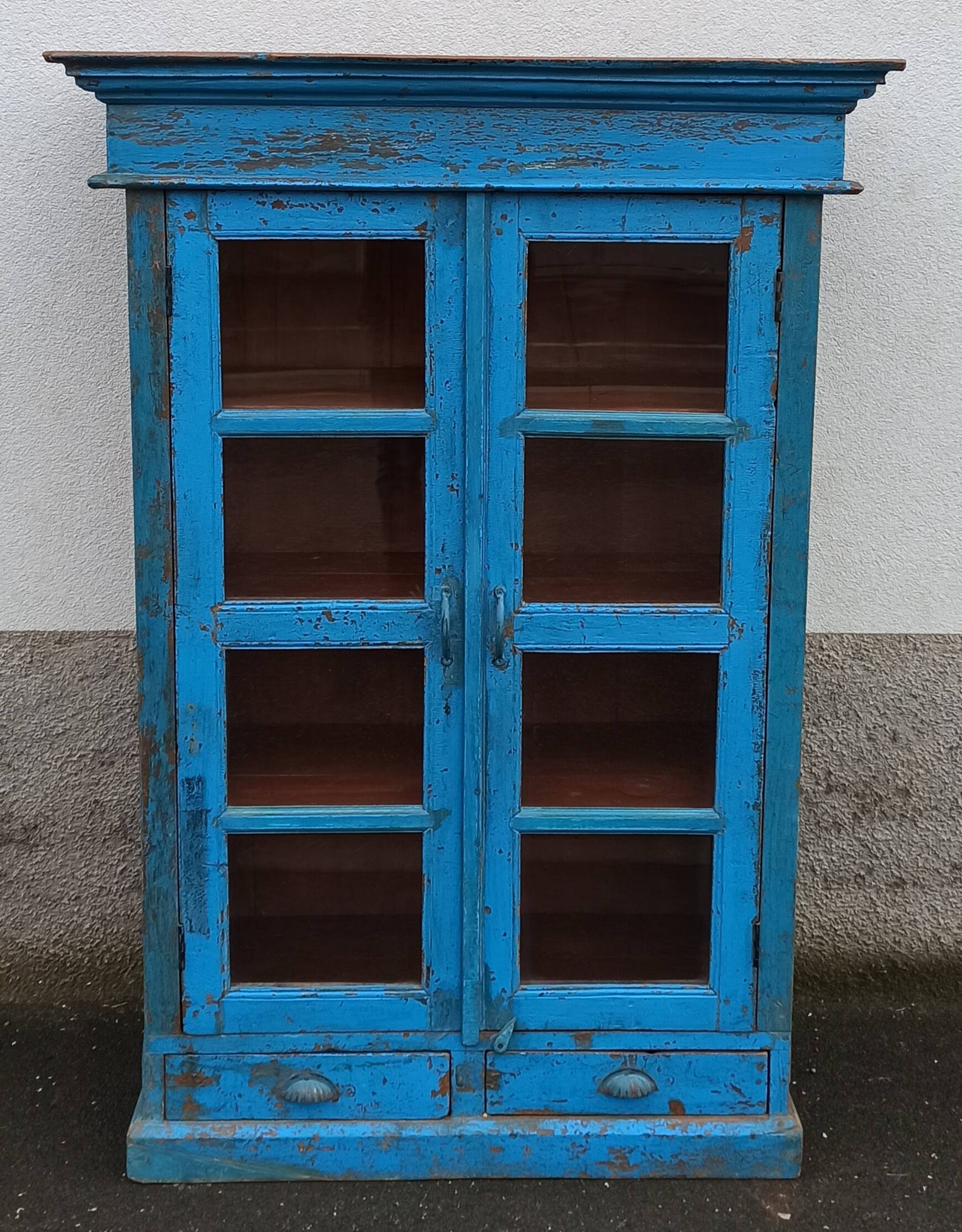 Old wooden glazed cabinet with two doors and two drawers