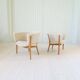 Mid-century lounge chairs in sheepskin/shearling and stained wood, Sweden, 1962.