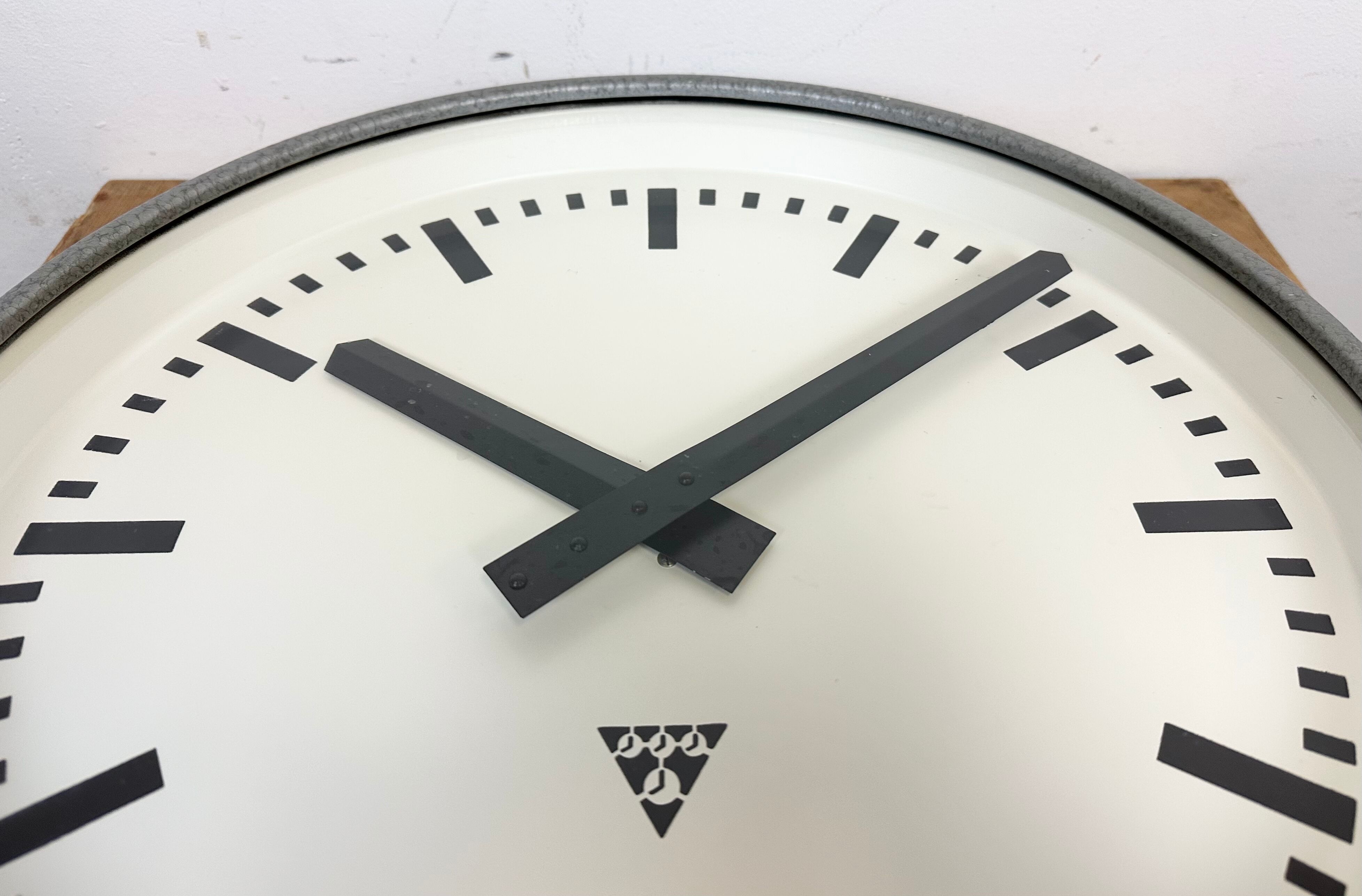 Grey industrial factory wall clock from pragotron, 1960s