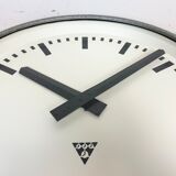 Grey industrial factory wall clock from pragotron, 1960s