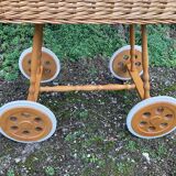 Vintage wicker cradle on casters