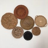 Wall composition of seven baskets and wicker trays