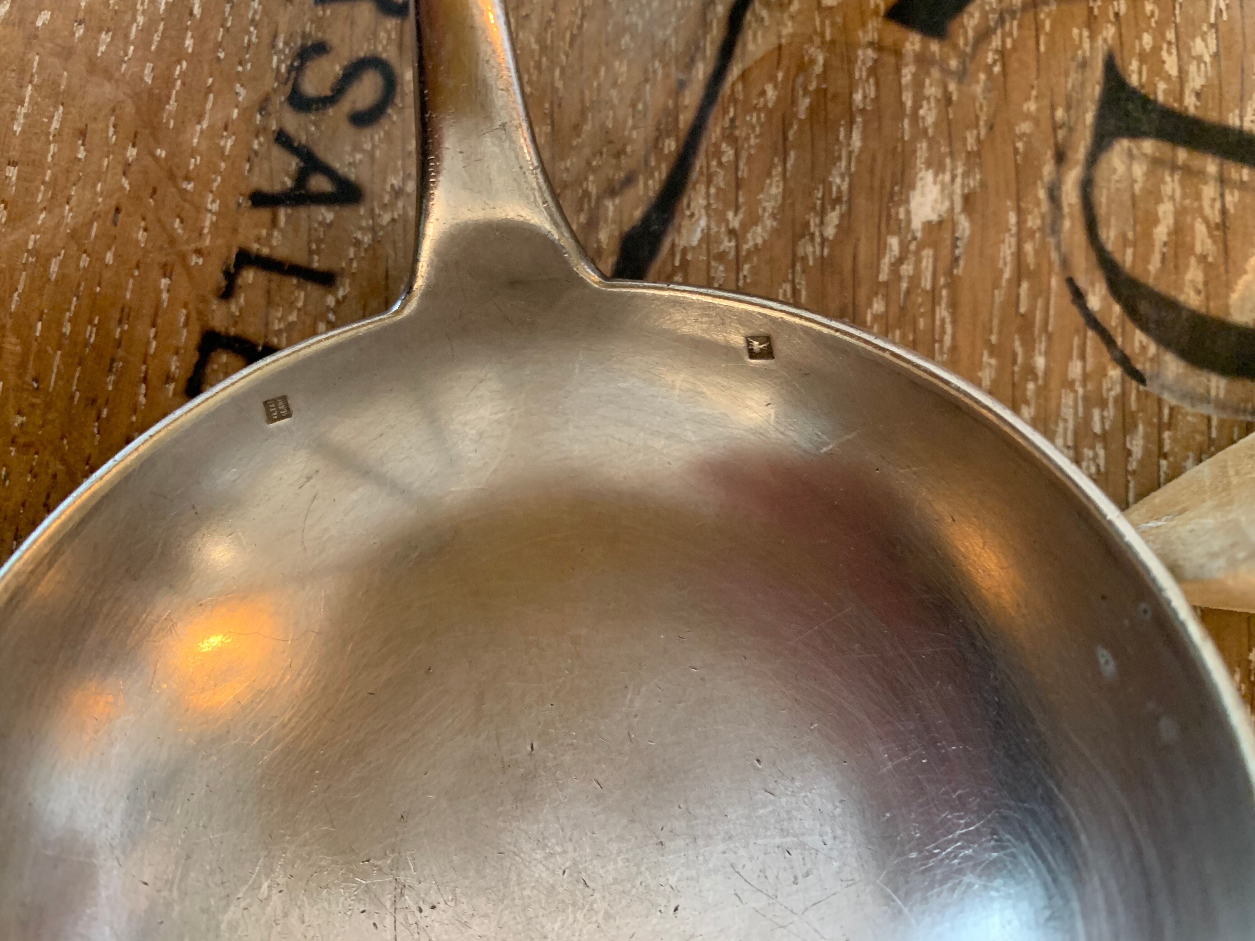 1 ladle and 1 spoon in silver