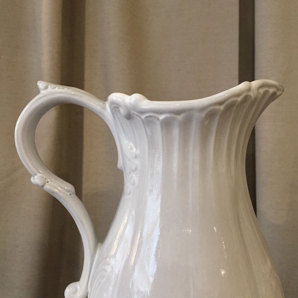 Pitcher has beautiful model beyerle niderviller black earth enamelled with white