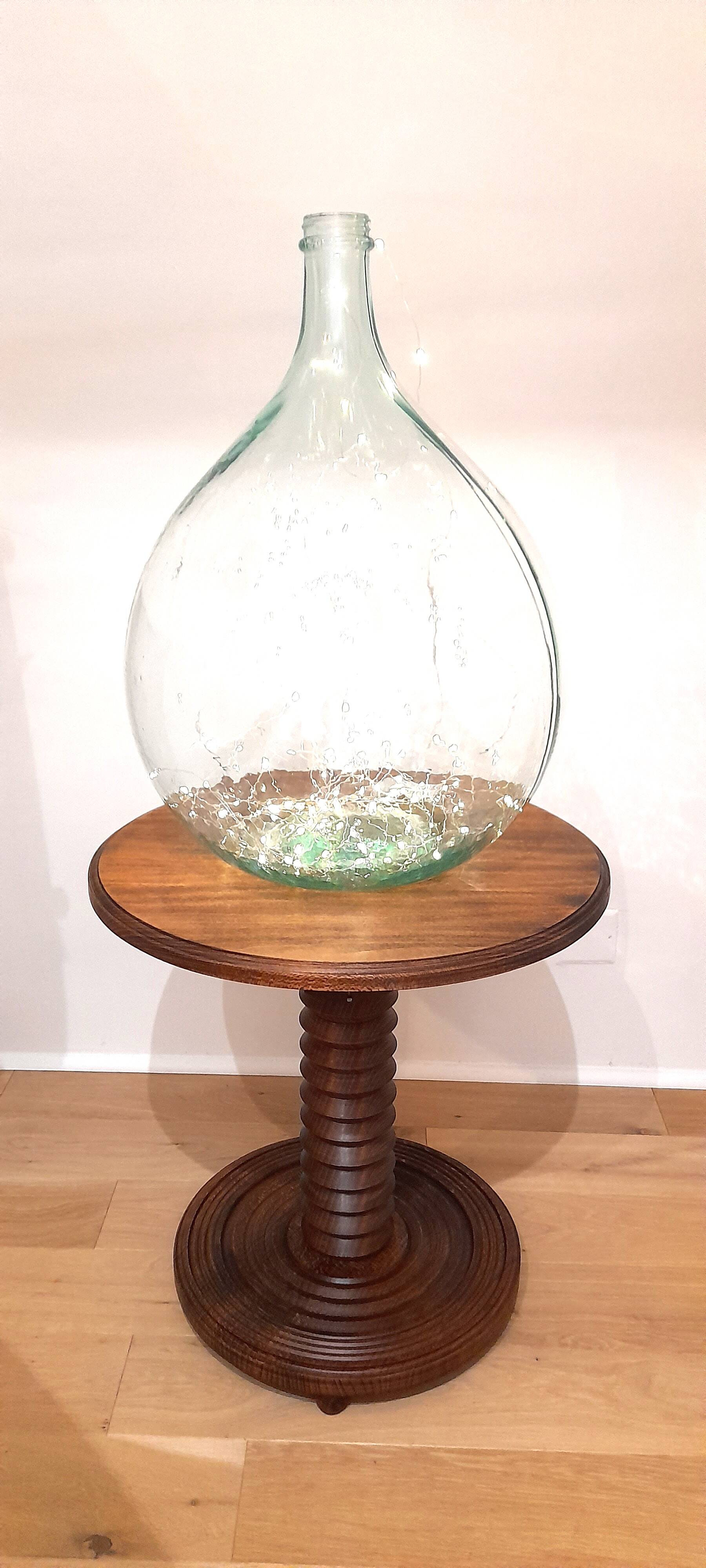 Brutalist side table with turned wood and wine press leg.