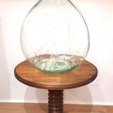 Brutalist side table with turned wood and wine press leg.