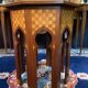 Thuyawood tea table with marquetry decoration.