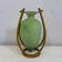 Rare glass paste amphora suspended in a wicker frame.
