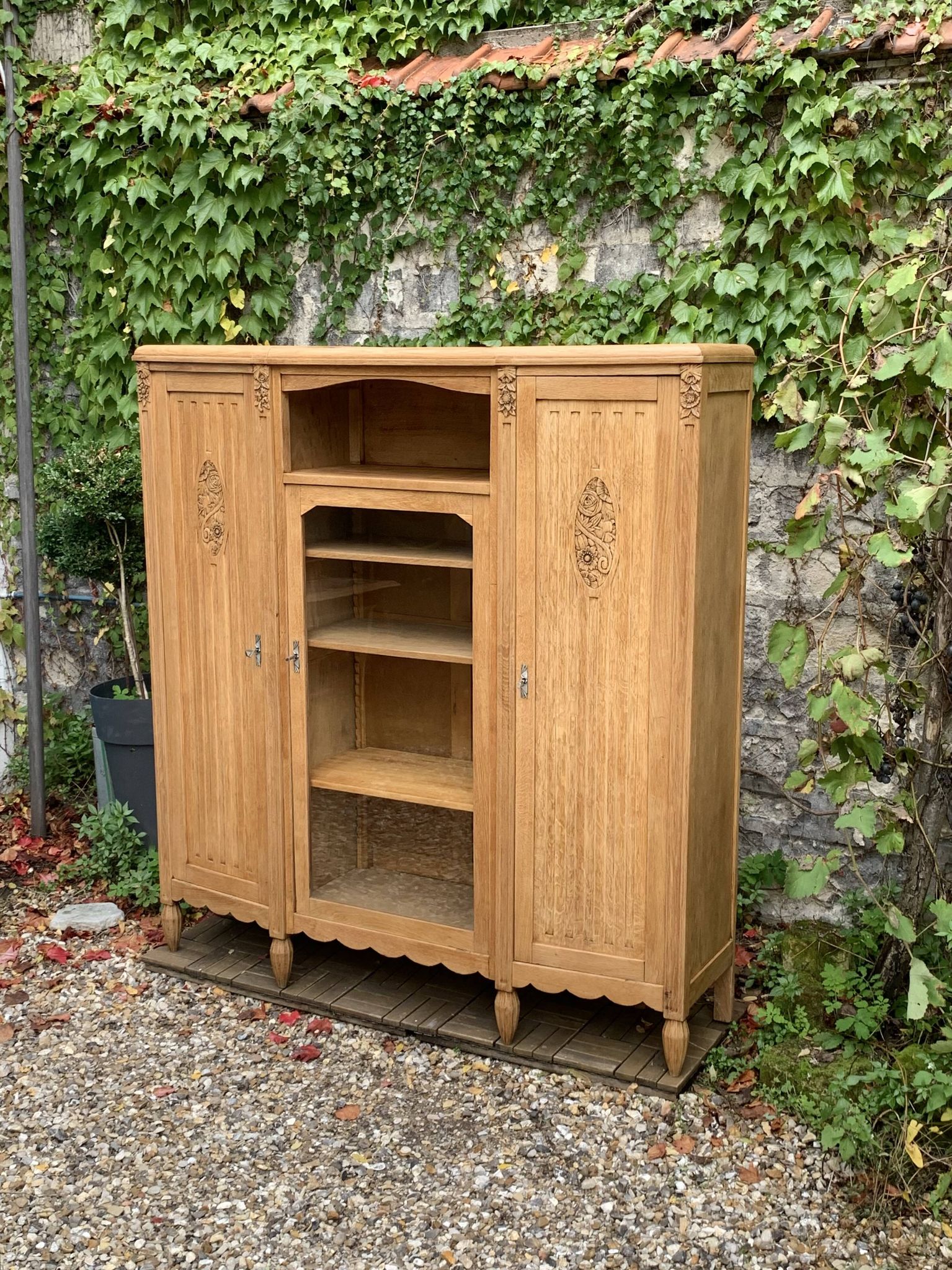 Asymmetrical Art Deco glass-fronted Parisian wardrobe in raw oak, 1930.