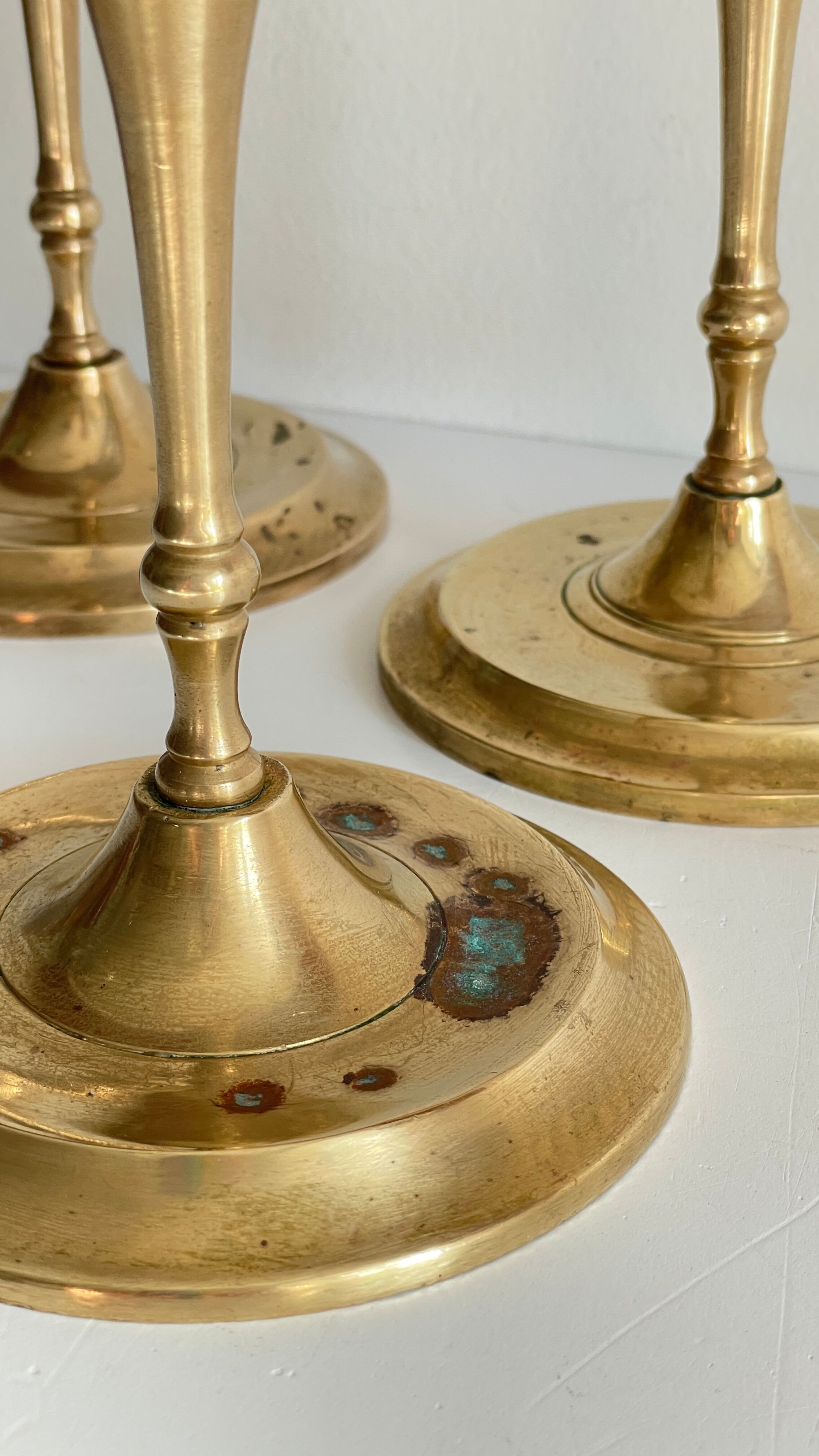 3 patinated brass candle holders