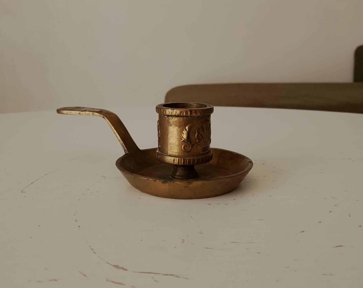 Antique hand-held candlestick in gilded bronze