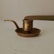 Antique hand-held candlestick in gilded bronze
