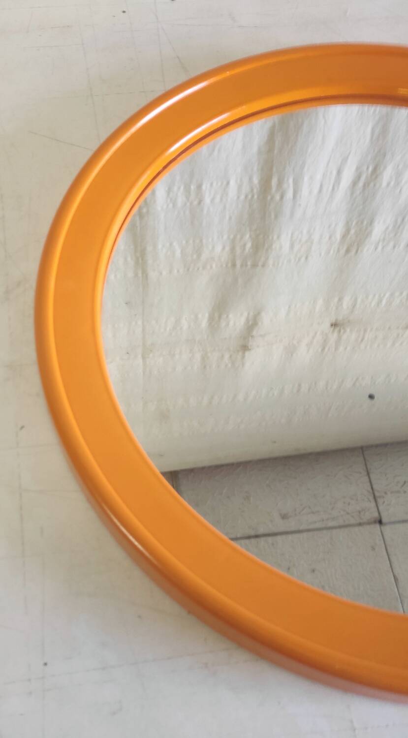 Round orange plastic mirror - 1970s