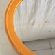 Round orange plastic mirror - 1970s