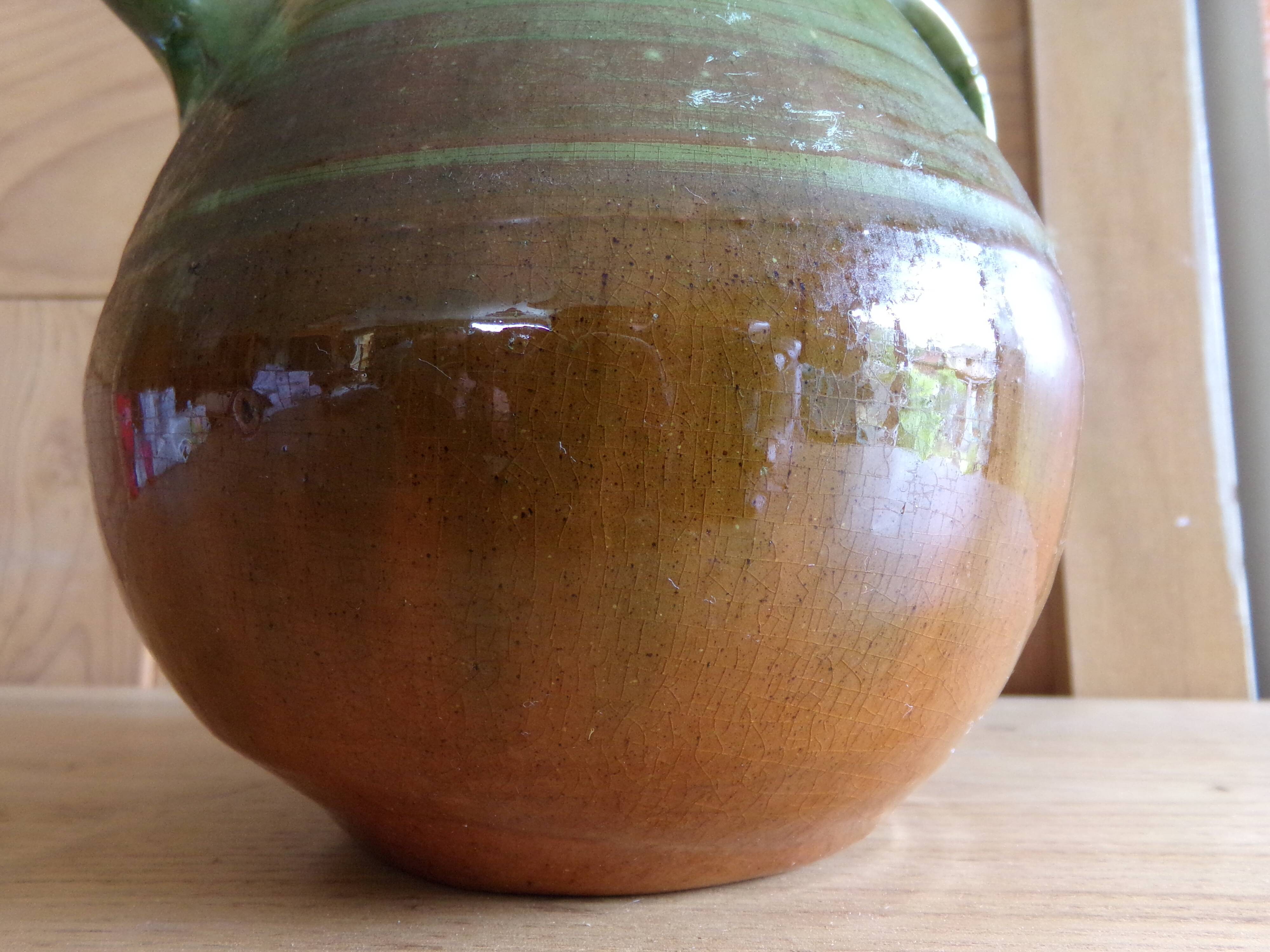 Enamelled terracotta jug