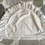 Two half-moon ruffled cushion covers
