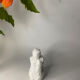 White ceramic seated sculpture