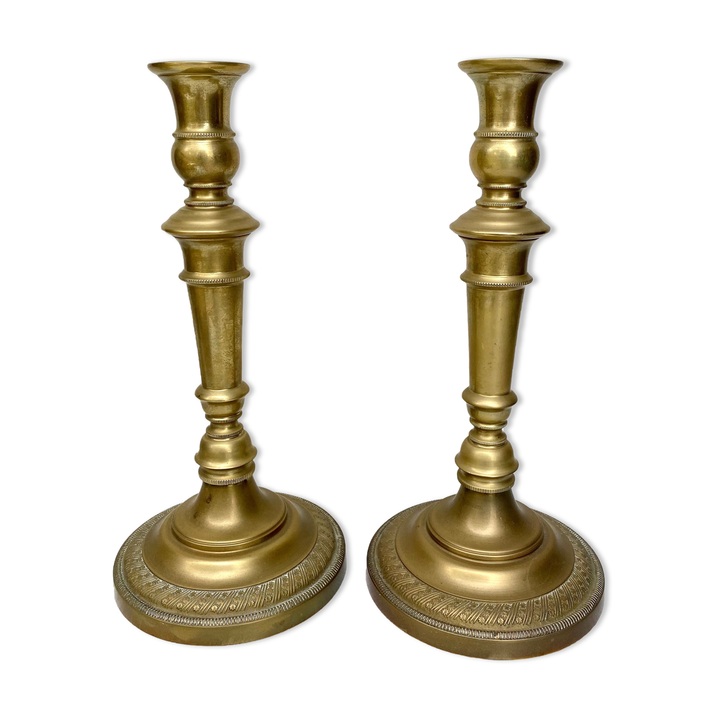 Pair of old candle holders in golden brass