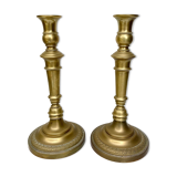 Pair of old candle holders in golden brass