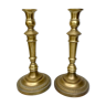 Pair of old candle holders in golden brass