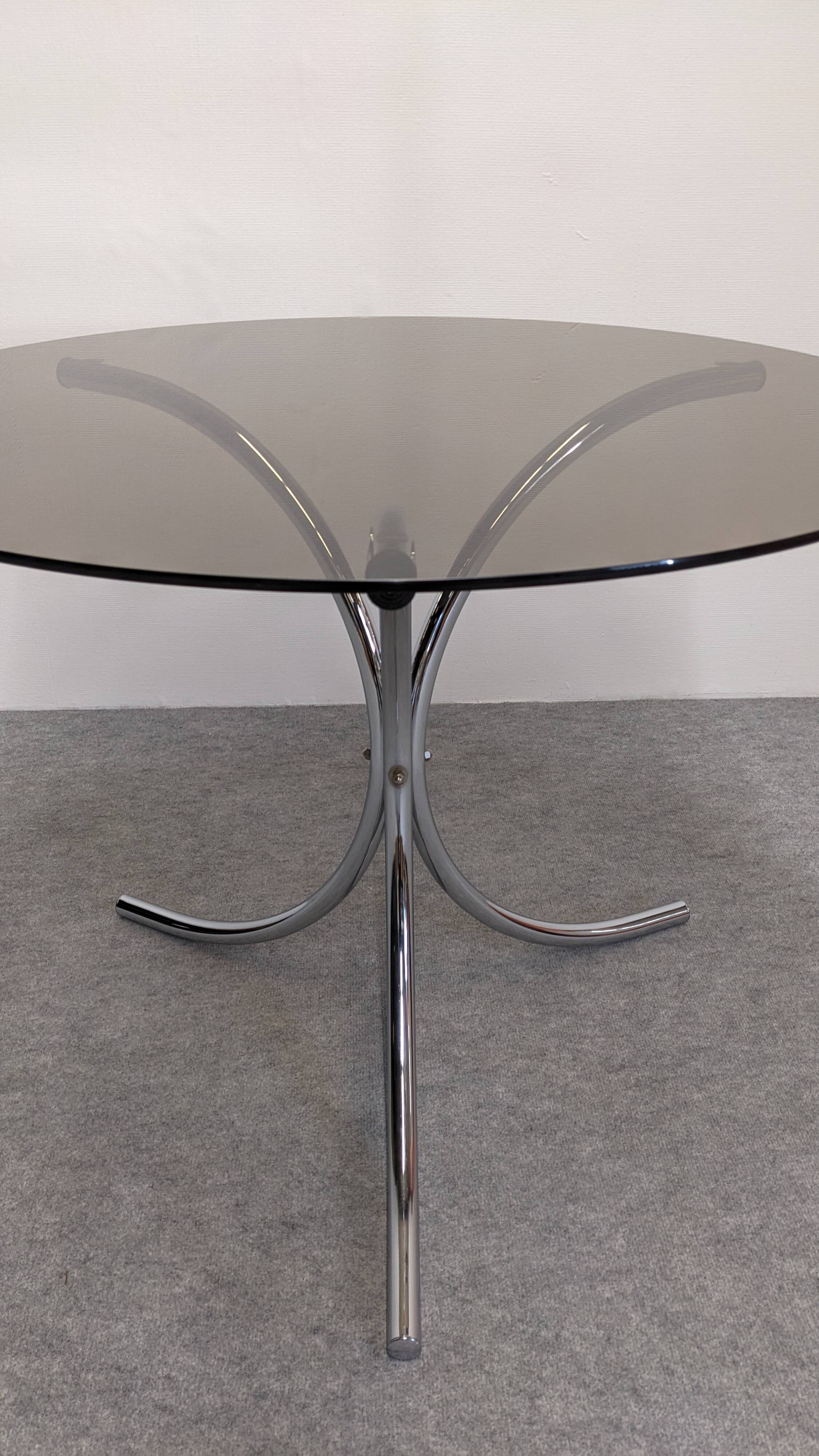 Chrome metal and smoked glass round table, Italy circa 1970.
