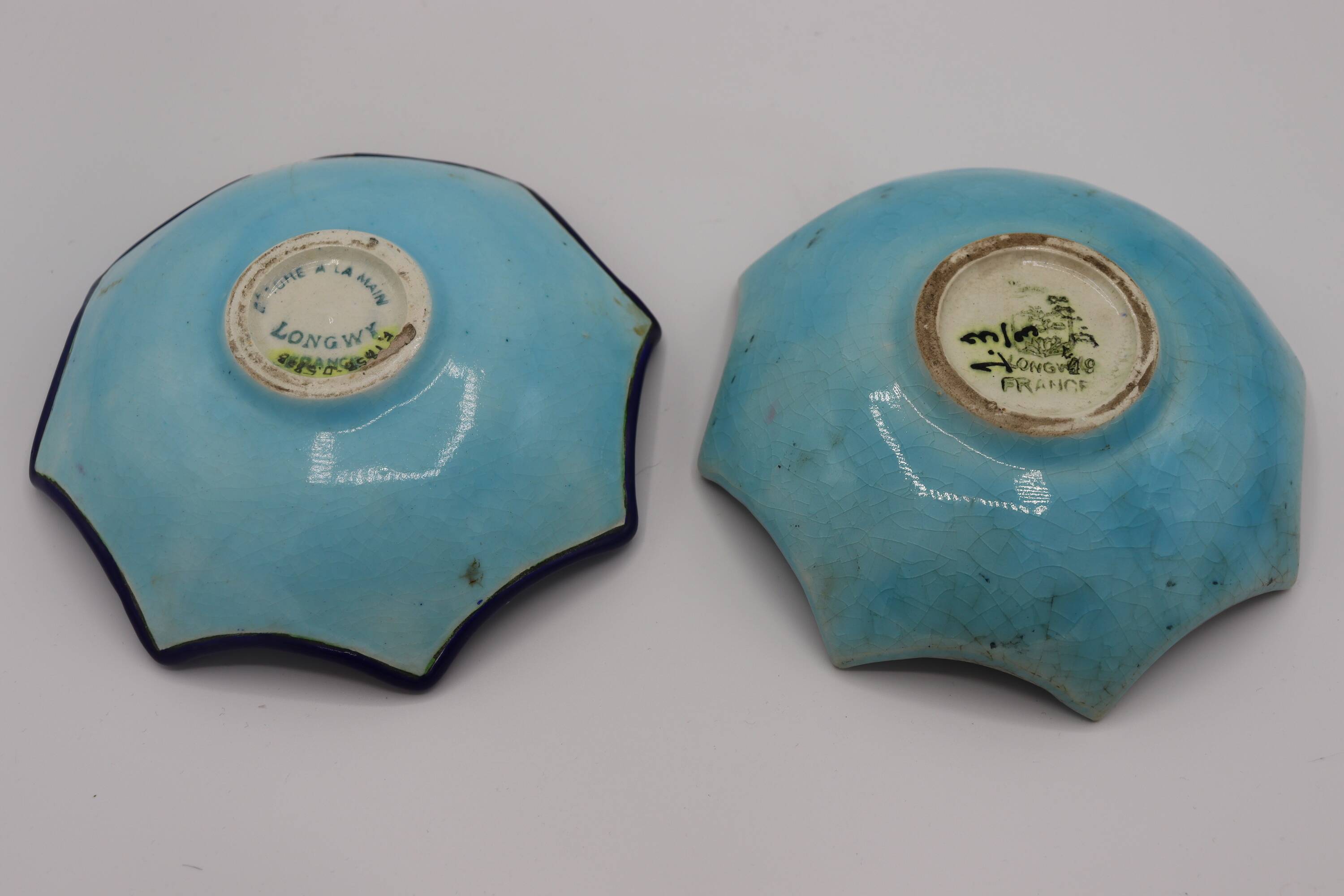 Duo of Longwy enamel saucers