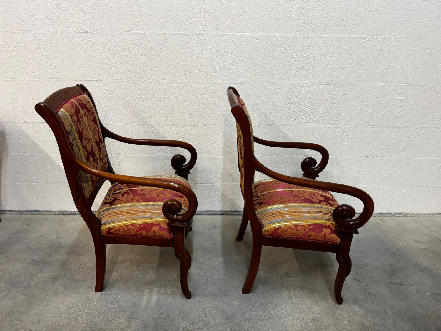 Pair of cross-back armchairs, Empire style, 19th century.