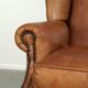 Sheepskin wingback armchair in a light cognac colour in English style