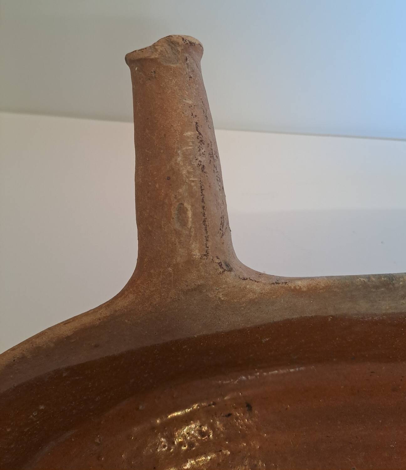 Old glazed terracotta frying pan from the 19th century.