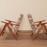 Pair of vintage lounge chairs in brown jacquard fabric and wood.