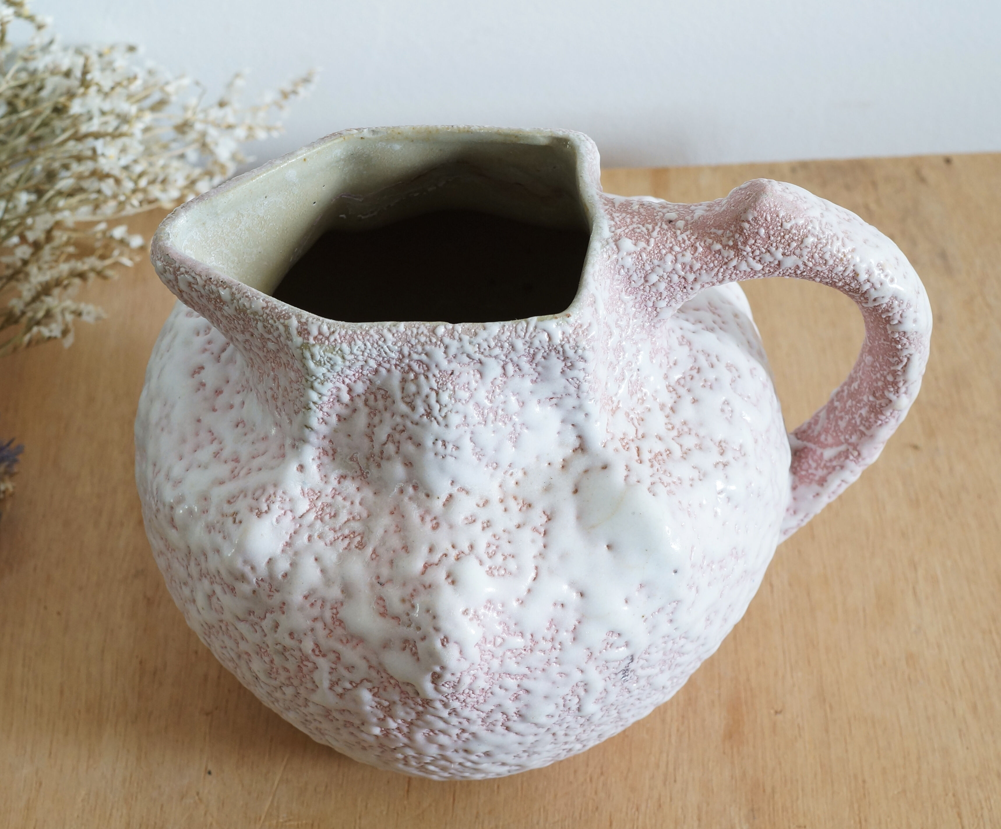 Art Nouveau ceramic pitcher with lava stone look