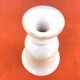 Vase on a pedestal, glazed white ceramic.