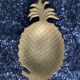 Bronze pineapple pocket emptier