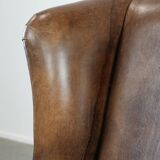 Warm, cosy and comfortable vintage sheepskin ear armchair with character