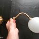 Brass and glass wall light