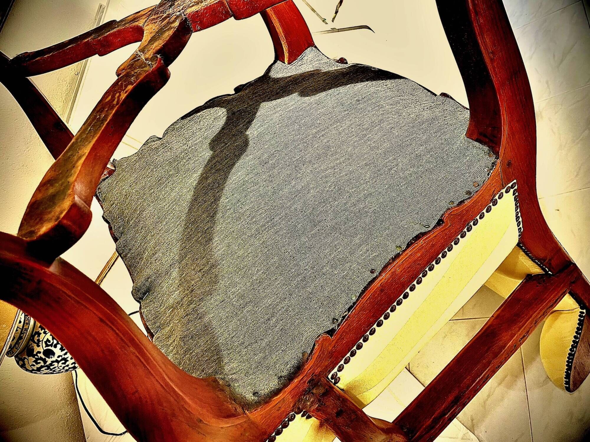 Wingback armchair in walnut in the French Regency style with stretcher in