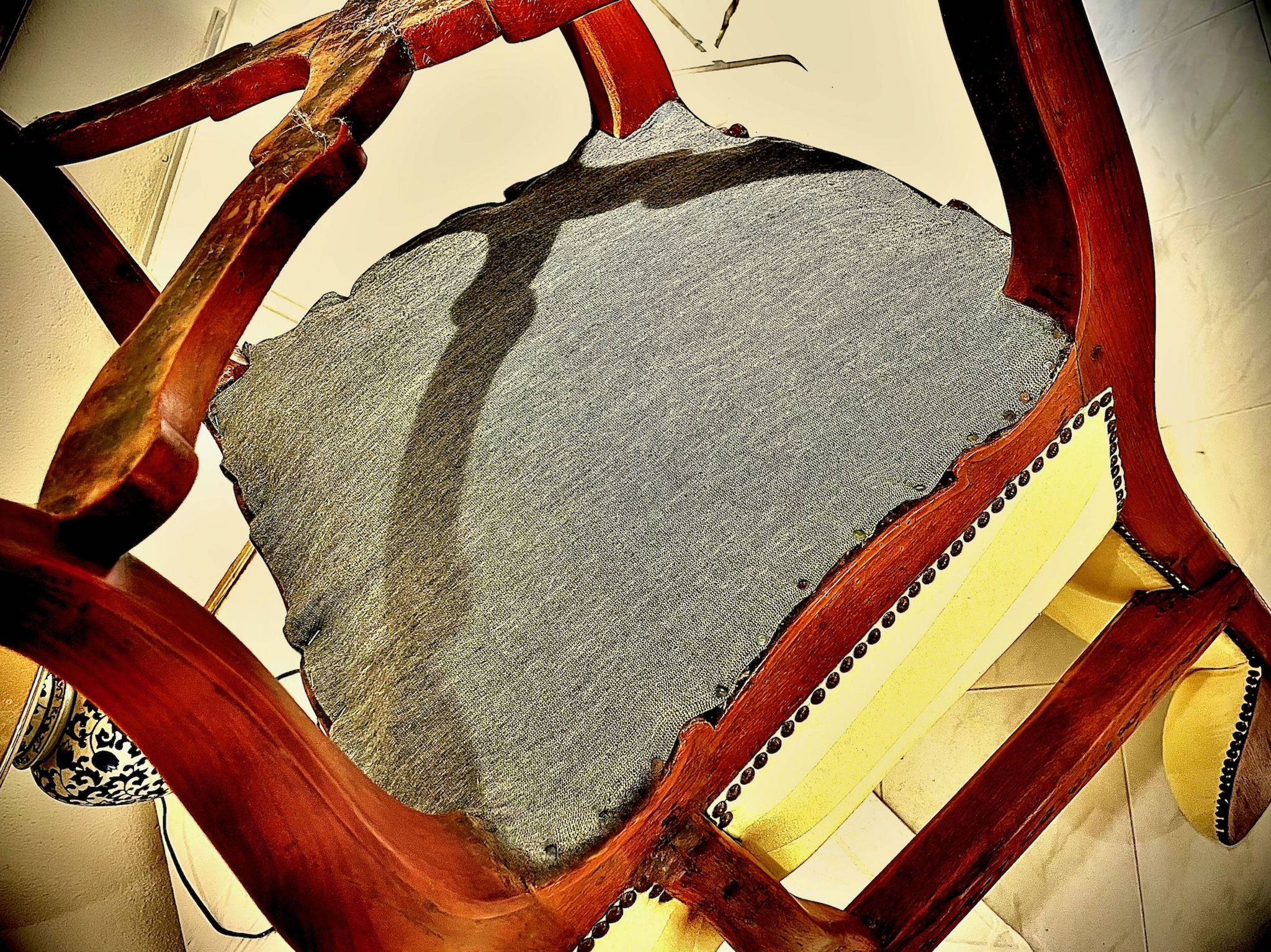Wingback armchair in walnut in the French Regency style with stretcher in
