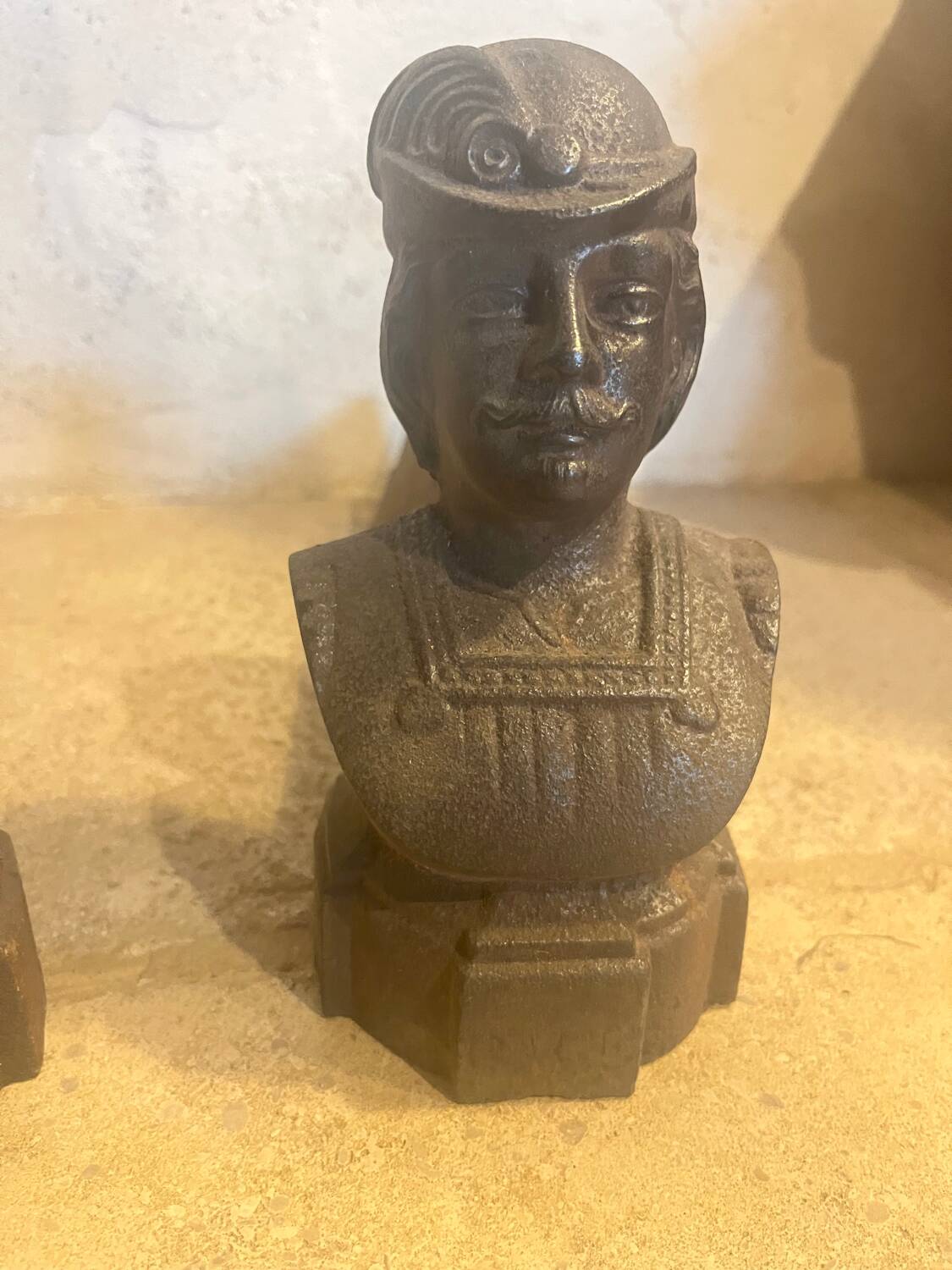 Pair of cast iron andirons with face