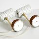 A pair of mid-century modern bedside lamps with perforated metal shades