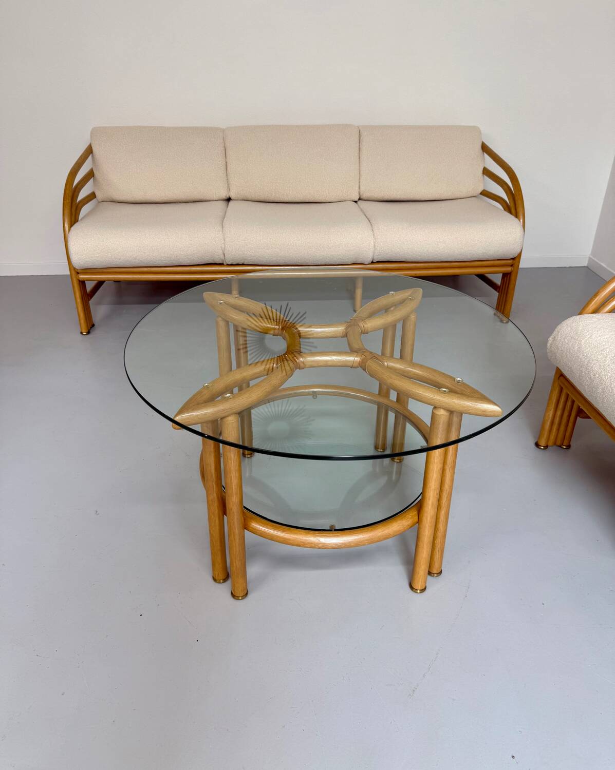 Complete living room with rattan sofa and white bouclette, brass finish, 80's design