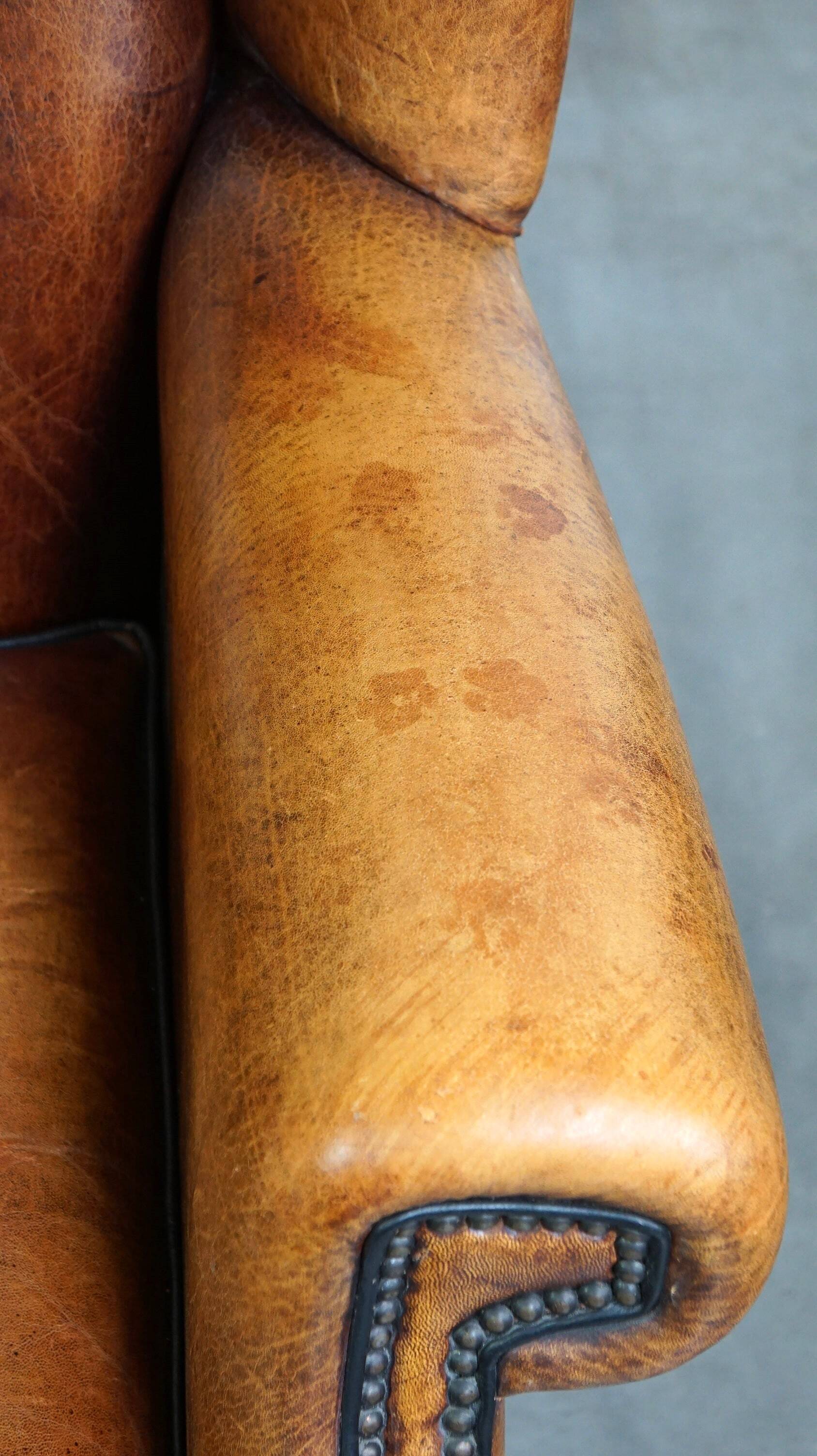 Sheepskin leather chair with a beautiful patina