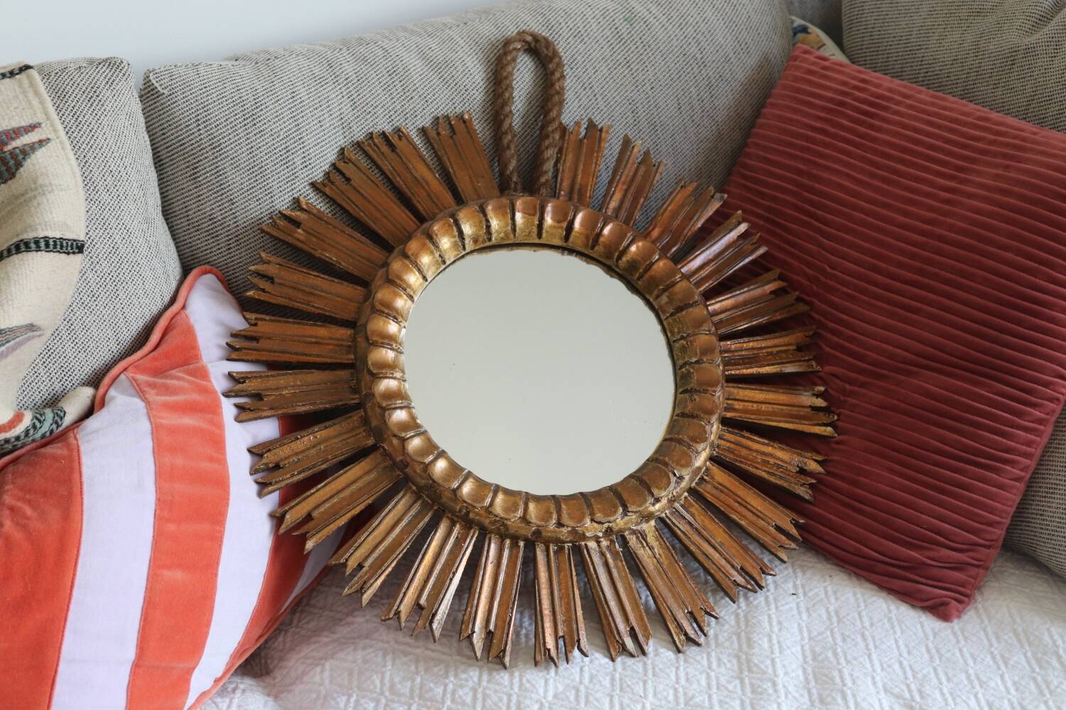 Old large sun mirror in gilded wood
