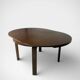 round brutalist extendable dining table from the 60s/70s