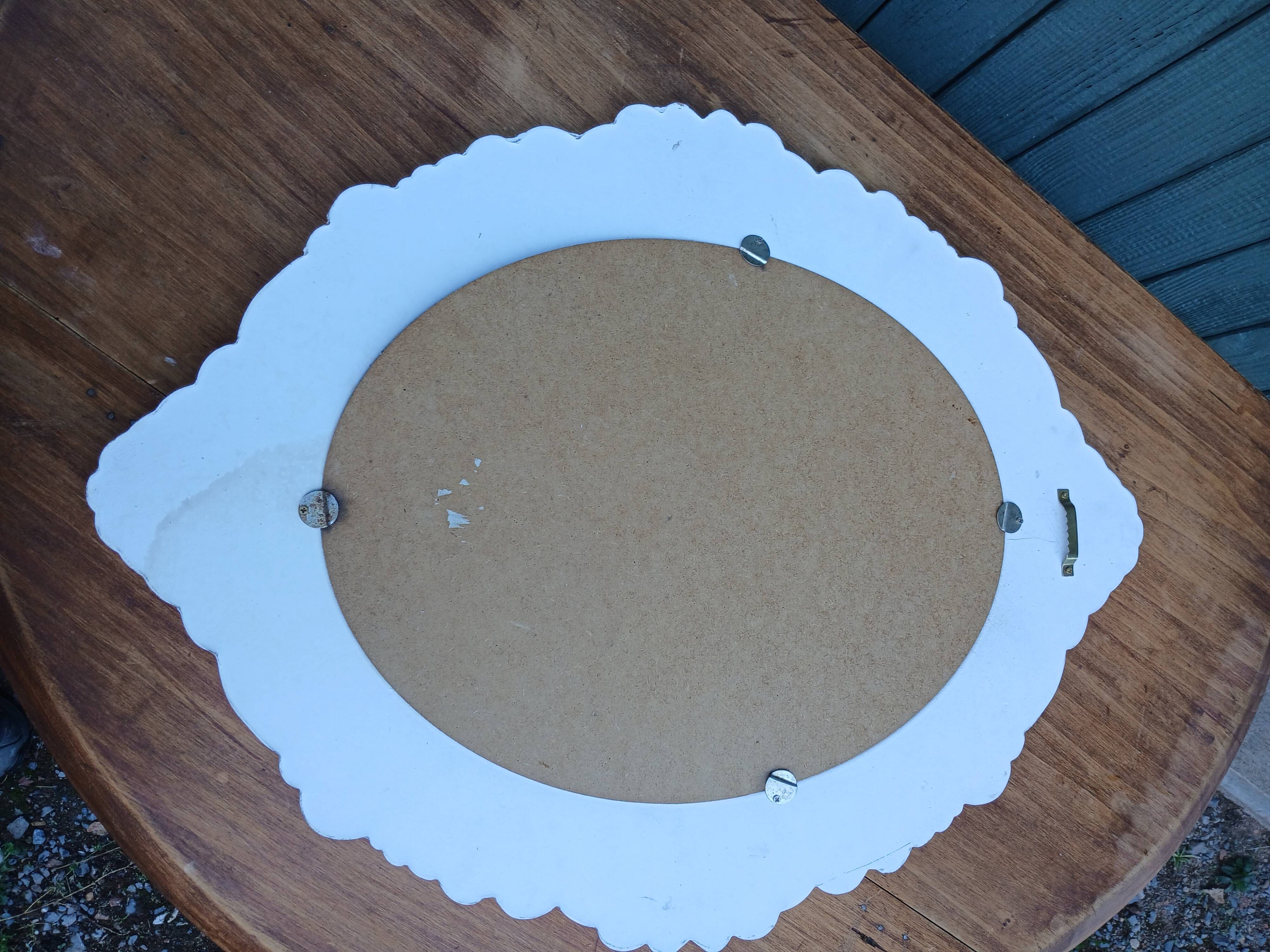 Oval mirror with white frame