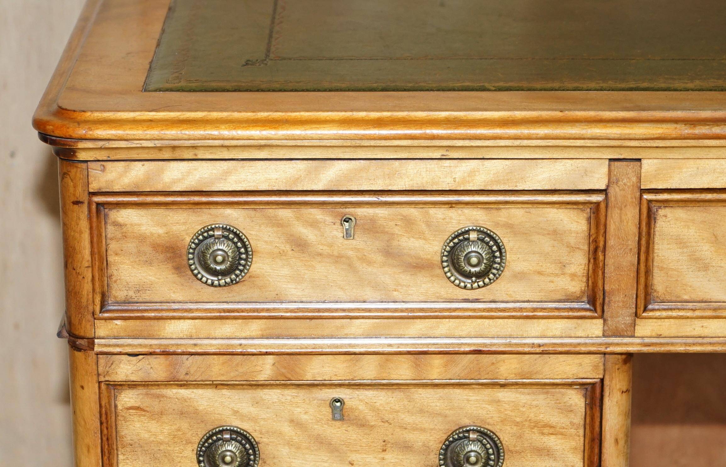 Antique desk by James Winter & Sons London in satin wood and leather.