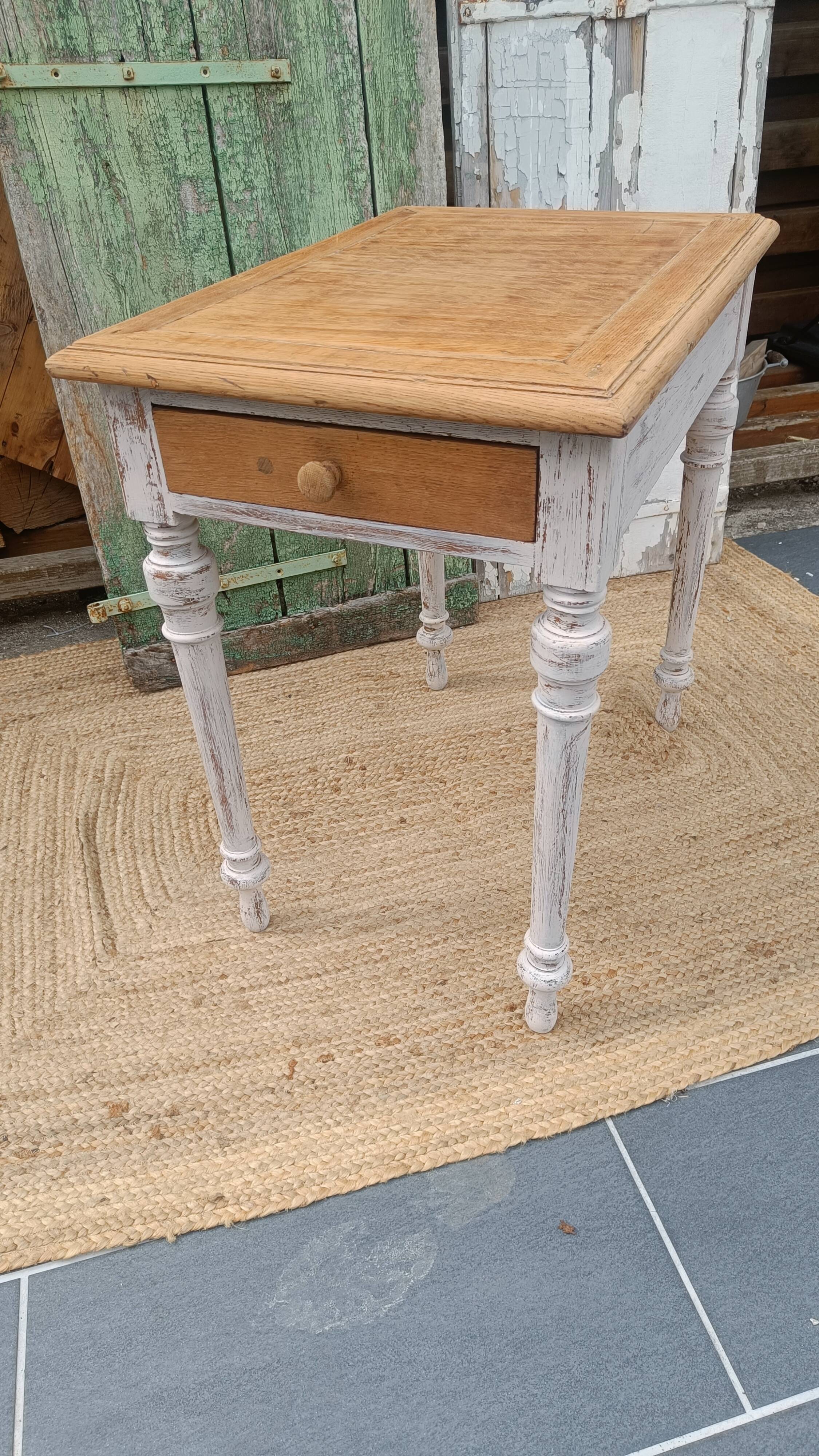 Antique drawer table with a patina.
