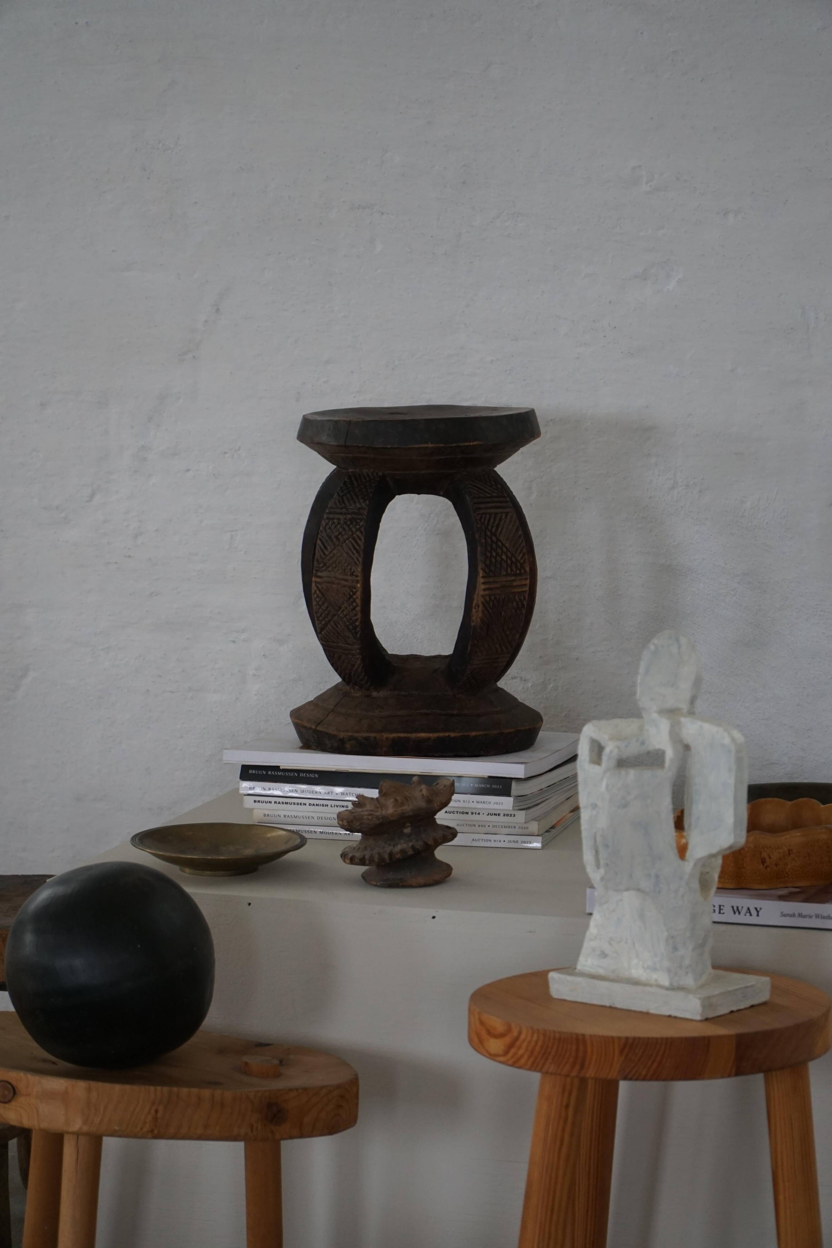 African Dogon stool from the mid-20th century, hand-carved in wood, Wabi-Sabi style.