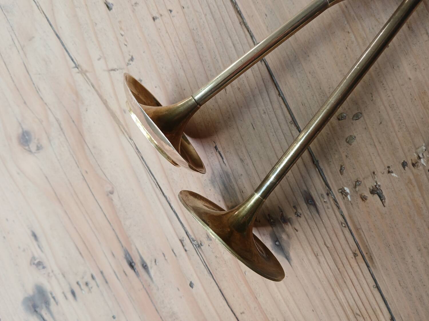 Set of two straight brass candlesticks.