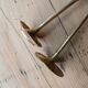 Set of two straight brass candlesticks.